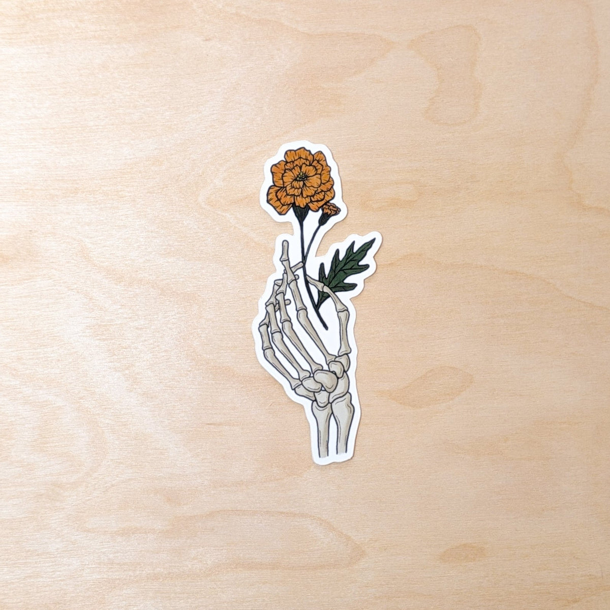 Skeleton Hand Holding Marigold Halloween Sticker